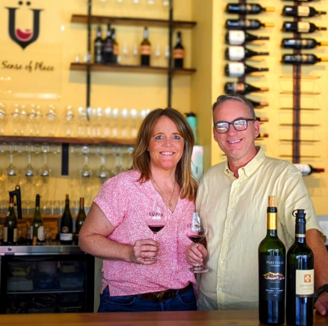 About Julie and Doug Oldfield at Kuper Wine Bar standing